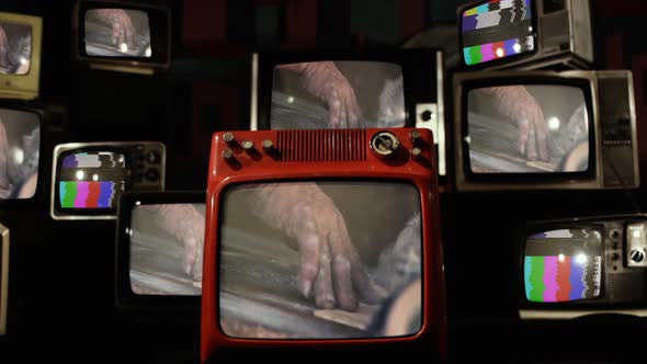 Hands of a Carpenter on Retro TVs.