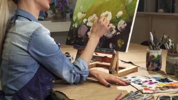 Cropped Shot of a Smiling Female Artist Drawing Flowers at Her Art Studio alt