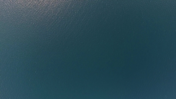Flying Over Blue Sea Water Surface alt