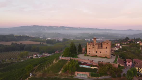 Grinzane Cavour Medieval Castle at Sunset in Langhe, Piedmont Italy Aerial View alt