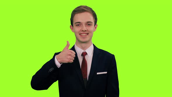 Young Stylish Man in Suit Showing Thumb Up