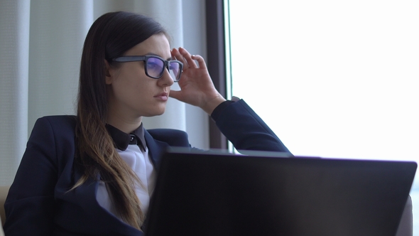 Young Attractive Woman in Office Suite Is Thinking Looking in the Window,nervous