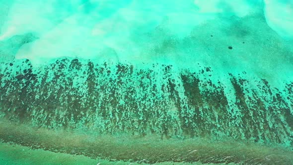 Aerial seascape of perfect shore beach vacation by transparent water with white sand background of a alt