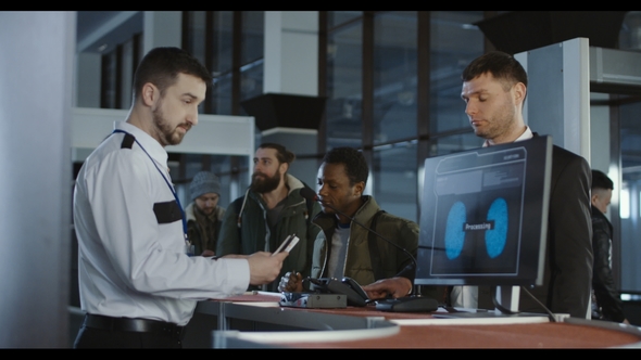 Security Officer Checking a Passenger Thumb Print alt