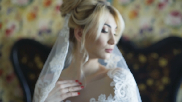Gorgeous Bride Smiles at Camera in Bedroom alt