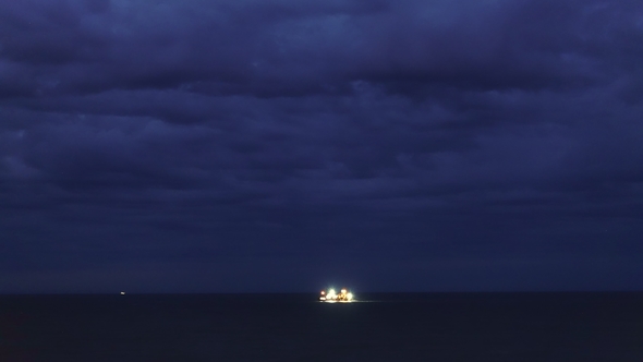 Night In Ocean And Storm Clouds Fishing Ships In The Distance By Perspective