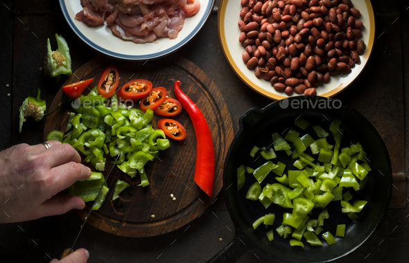 Man cuts green pepper for fajita top view Stock Photo by Deniskarpenkov