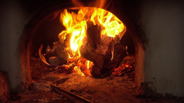 Firewood and Fire Flames in Fireplace. Bonfire and Coals alt
