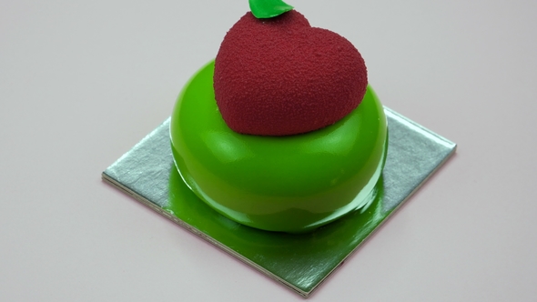 Bright and Colorful Cake Heart  on a Pink Background alt