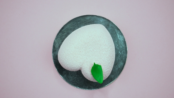 Bright and Colorful Cake Heart  on a Pink Background. Rotating Top View. alt