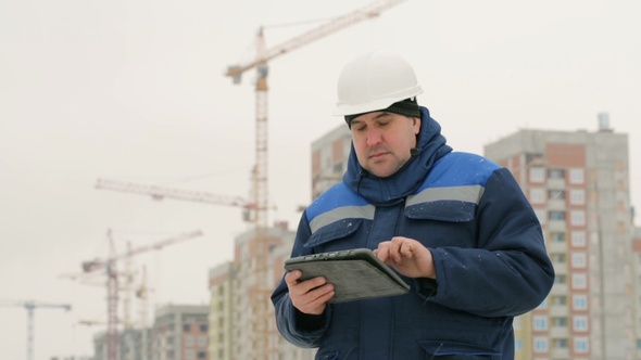 Foreman With Pad at Major Construction Project