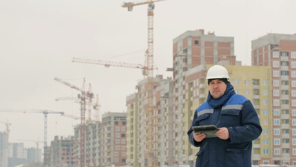 Foreman With Pad at Major Construction Project