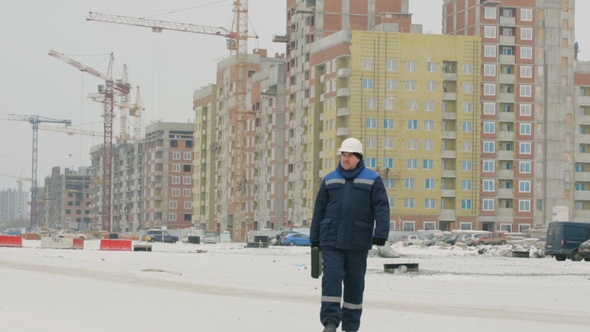 Foreman With Brief Case at Major Construction Project