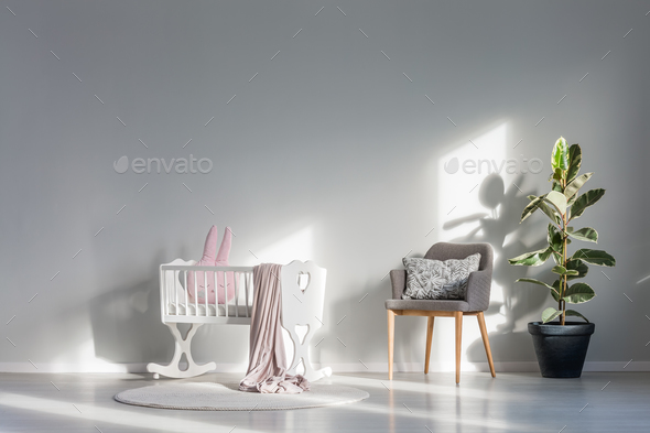 White cradle with pink blanket - Stock Photo - Images