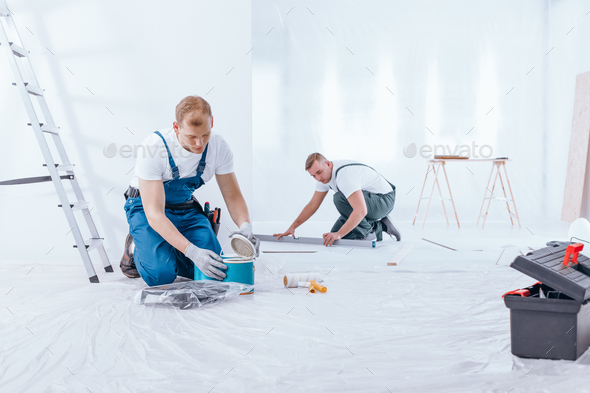 Painter during interior finishing work - Stock Photo - Images
