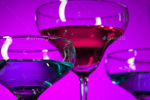 Three wine glasses standing on the table at studio - Stock Photo - Images