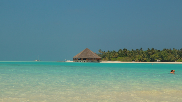 Resort Island with View of Turquoise Sea and Beach in Maldives