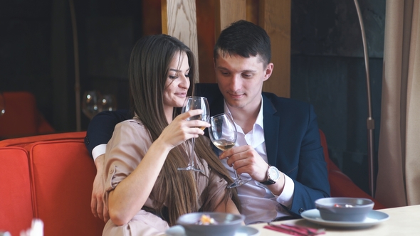 Couple Celebrate Valentine's Day with Romantic Dinner in Restaurant