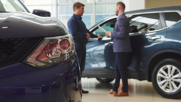 Businessmen Is Making a Deal of Buying a New Car