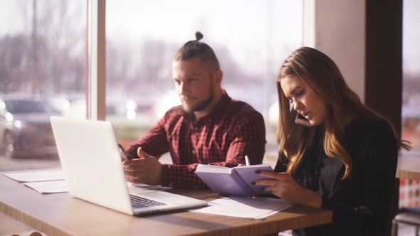 Man and Woman Sitting in Cafe Together at Business Lunch Brake alt