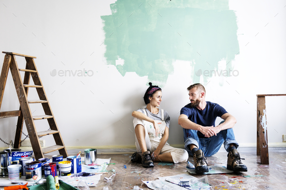 Couple renovating the house - Stock Photo - Images