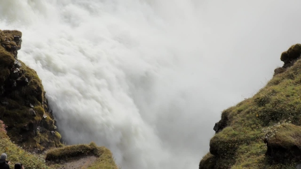 Rapid Flow of Powerful Waterfall Between Two Rocks Covered Moss, Epic View