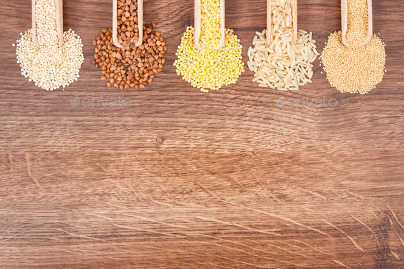 Various groats, rice, amaranth and quinoa seeds with scoop, healthy and gluten free food Stock Photo by ratmaner