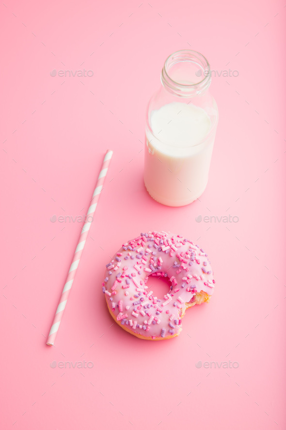 Pink donut and milk bottle. - Stock Photo - Images