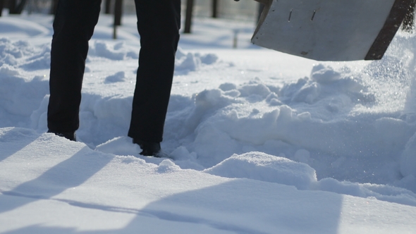 Man Shoveling the Snow From the Path