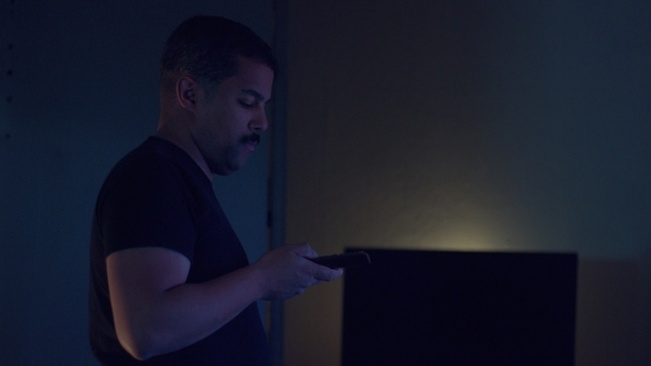 Upset Boring Mixed Race Man Watching Tv alt