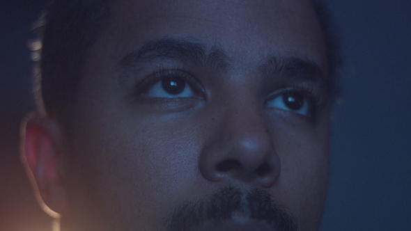 Upset Boring Mixed Race Man Watching Tv alt