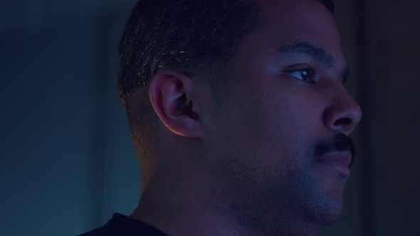 Upset Boring Mixed Race Man Watching Tv alt