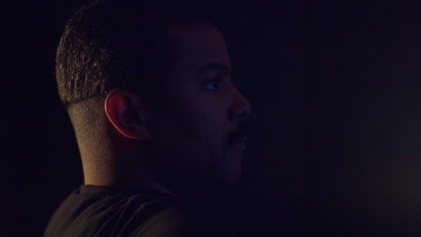 Upset Boring Mixed Race Man Watching Tv alt