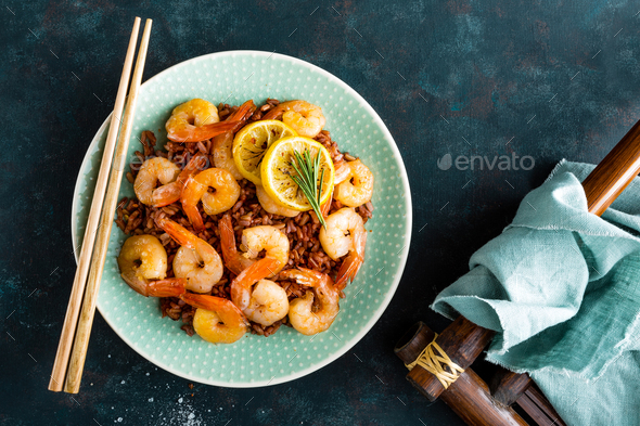 Prawns roasted on gril and rice - Stock Photo - Images