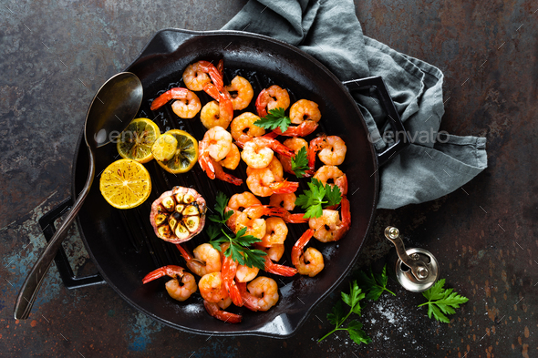 Prawns roasted on grill frying pan Stock Photo by sea_wave | PhotoDune