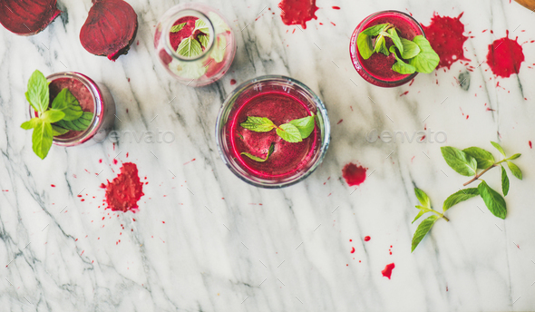 Fresh beetroot smoothie in glasses over marble background, top view - Stock Photo - Images