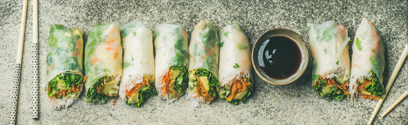 Flat-lay of vegan spring, summer rice paper rolls, wide composition - Stock Photo - Images