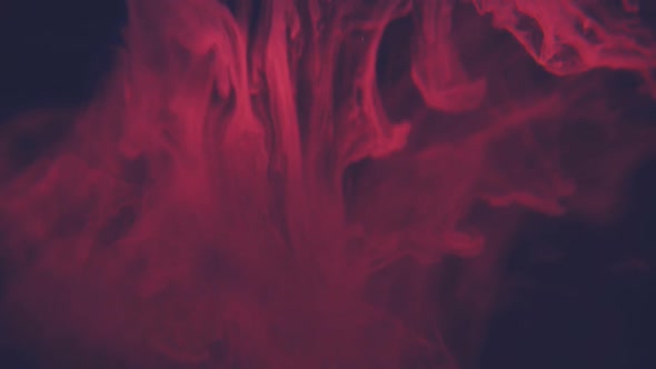 Abstract Red Ink Flowing in Water