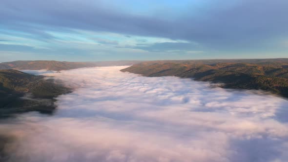 Aerial View of a Stream of Fog in a Mountain Gorge, Hyperlapse.