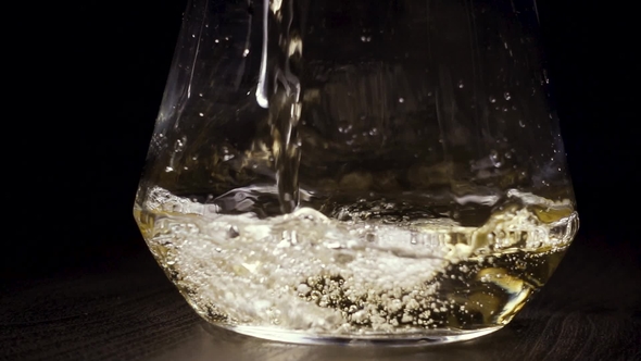 White Wine Is Poured Into the Decanter