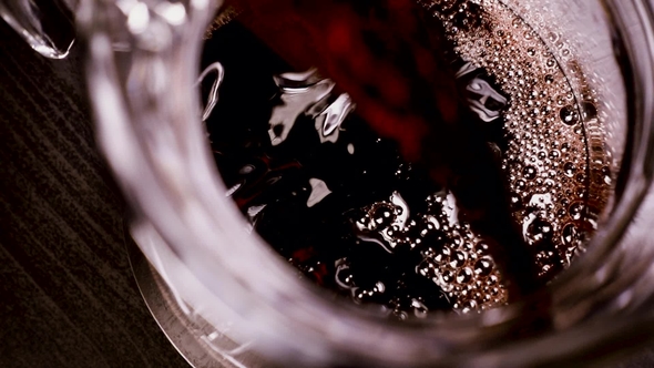 Red Wine Is Poured Into a Carafe