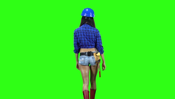 Rear View of Girl Wearing Helmet and Shorts Walking alt