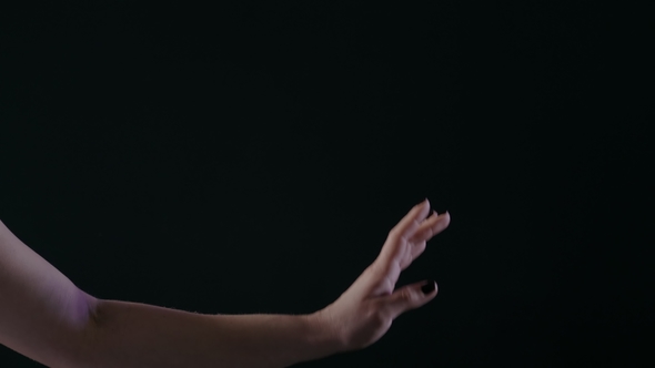 Ballerina Dancing on Stage or Dark Classroom Studio,  of Only Hands with Magic Light on Background alt