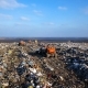 City Dump The Bulldozer Compacts the Garbage on the Landfill Wastes of Human Life - VideoHive Item for Sale