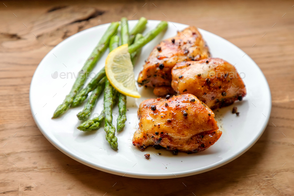 Plate of grilled chicken meat and asparagus - Stock Photo - Images