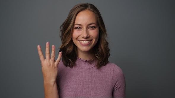 Woman Showing Four Fingers alt