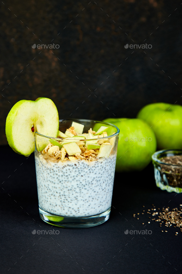 Healthy chia pudding with apples and granola in glass. - Stock Photo - Images