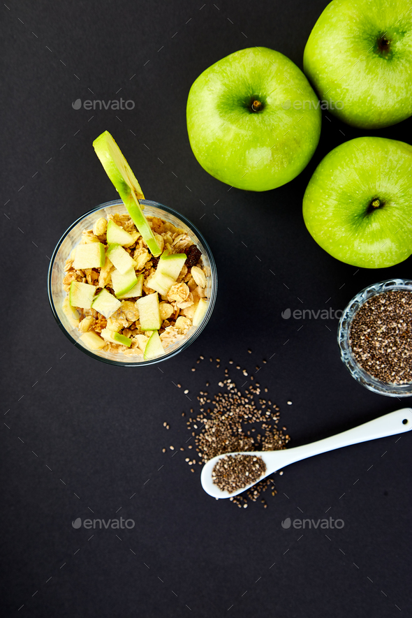 Healthy chia pudding with apples and granola in glass. - Stock Photo - Images