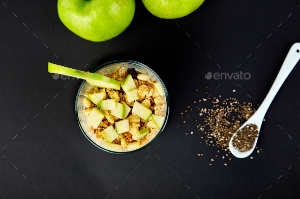 Healthy chia pudding with apples and granola in glass. - Stock Photo - Images