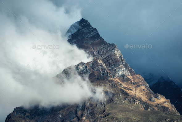 Mountains in clouds in overcast evening in Nepal - Stock Photo - Images